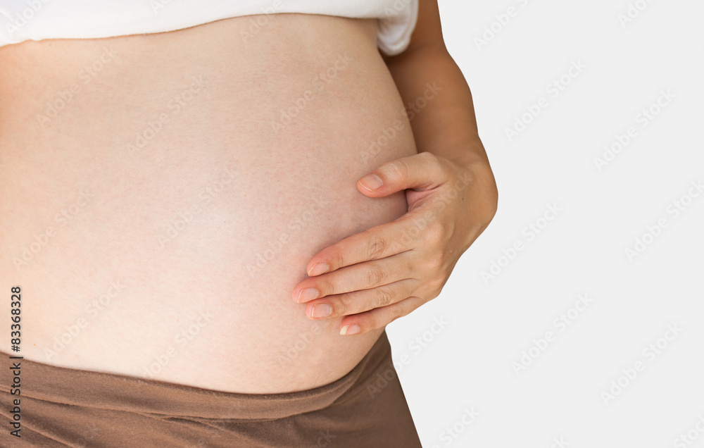 Pregnant woman holding her hand on belly Pregnant woman holding her hand on belly