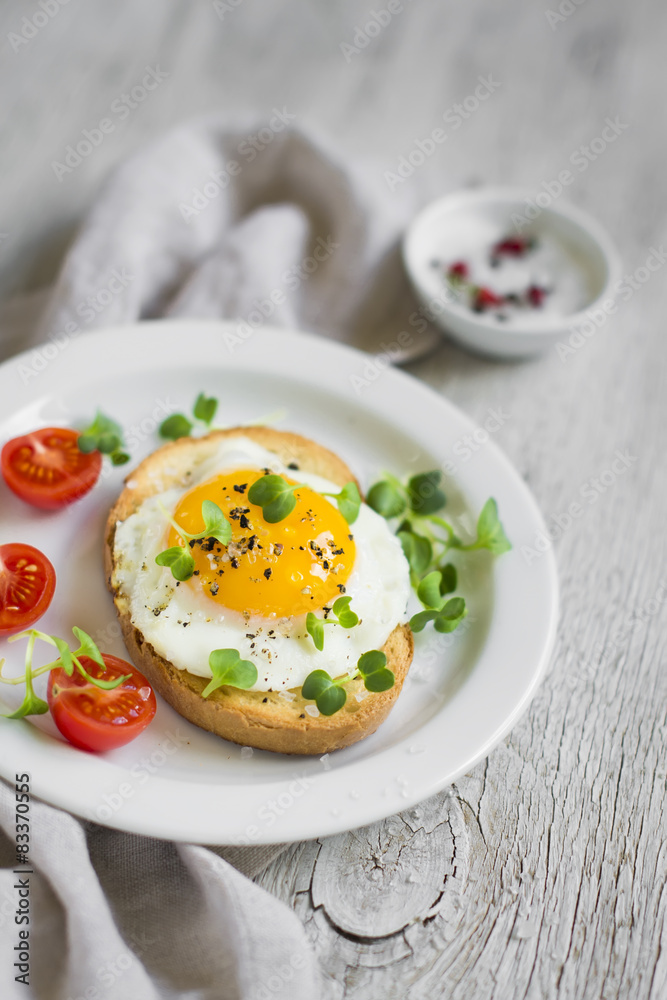 toast with egg on a white plate toast with egg on a white plate