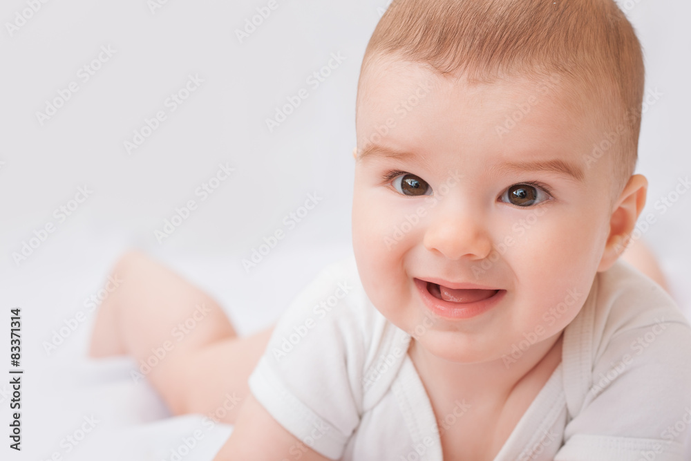 Cute smiling baby boy on white background