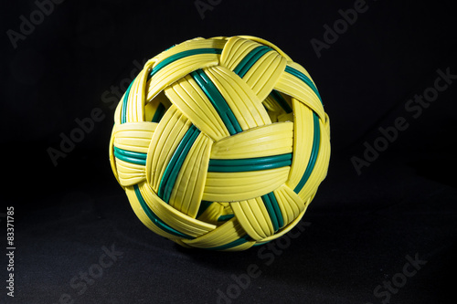 Rattan ball on black background photo