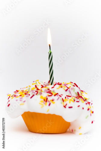 Cupcake with a lit candle