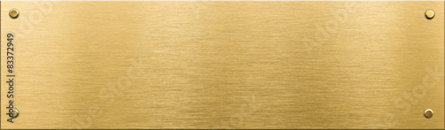 gold metal plaque or nameboard with rivets  photo