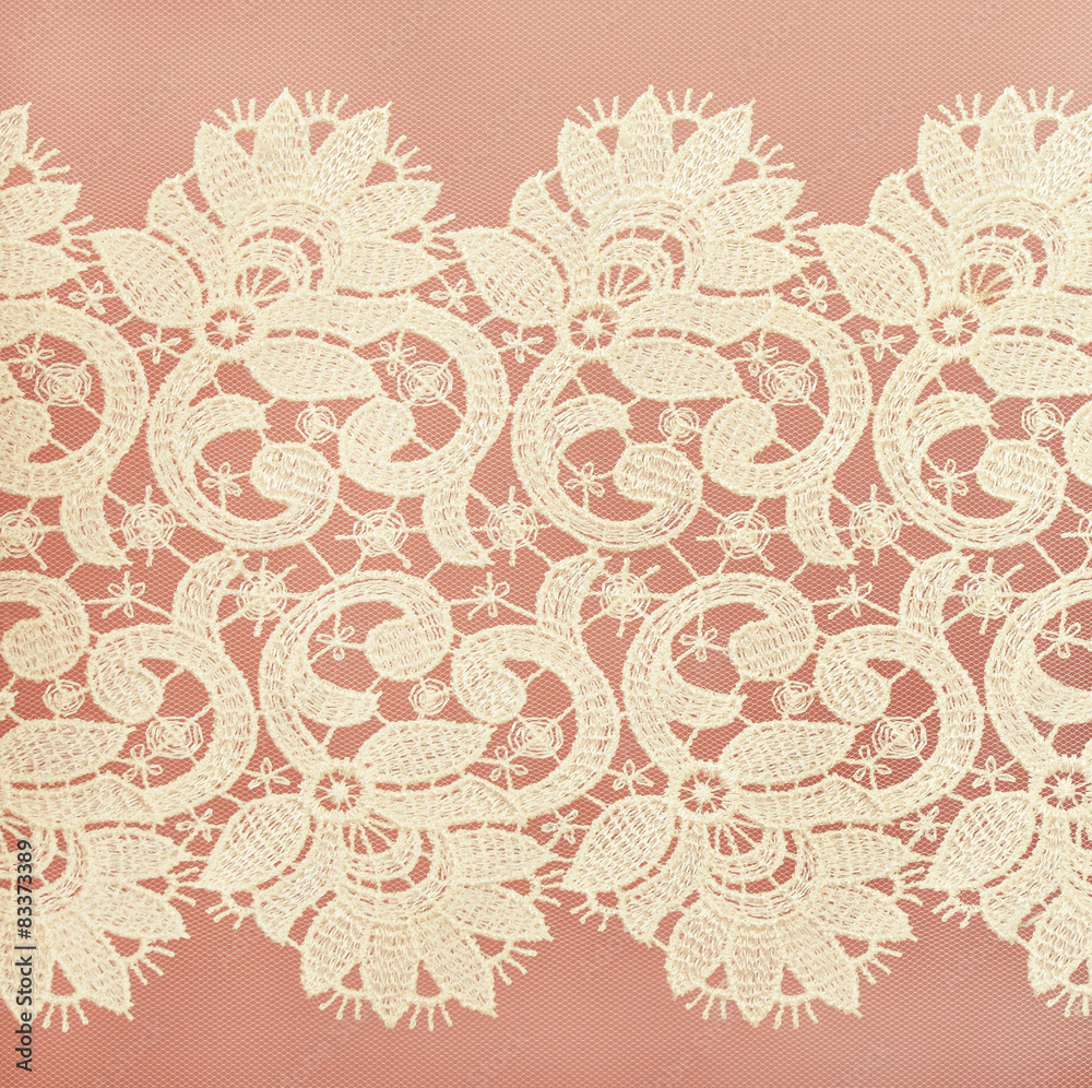 Fototapeta premium White lace on pink background