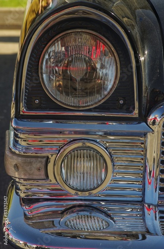 Fragment of a retro car. Grille, headlight. Gaz-13. Chaika.
