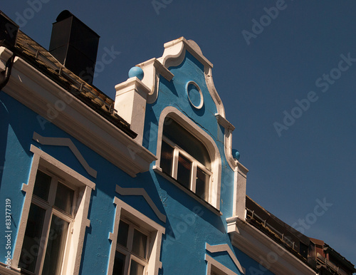 Jugend, Art nouveau building, Ålesund, Aalesund, Norway, close up with beautiful details, blue building against blue sky.