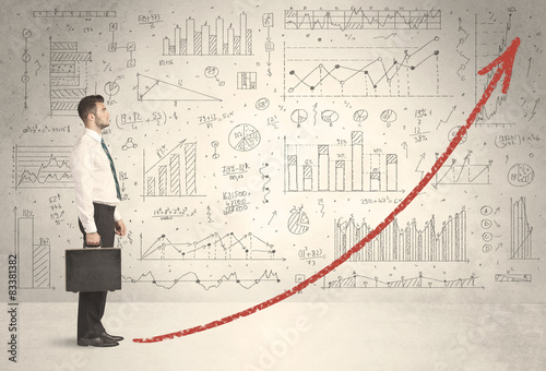 Business man climbing on red graph arrow concept