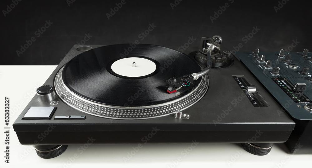 Turntable playing vinyl close up with needle on the record Turntable playing vinyl close up with needle on the record