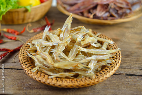 dried fish on wood background