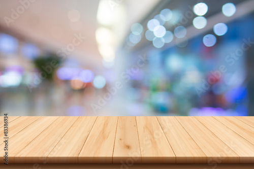 Shopping mall blur background and wooden floor