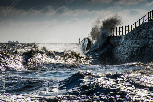 Storm sea back wash off harbour arm.