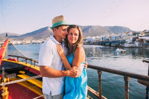 Wallpaper Mural Happy young couple in love relaxing on a yacht at sea. Luxury va Torontodigital.ca
