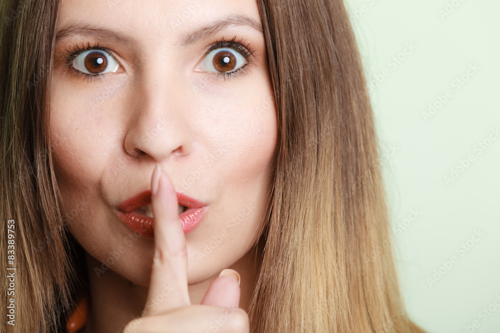 Woman asking for silence finger on lips hush hand gesture. Woman asking for silence finger on lips hush hand gesture.