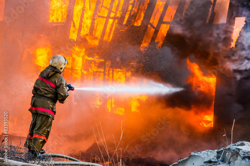 Fireman extinguishes a fire