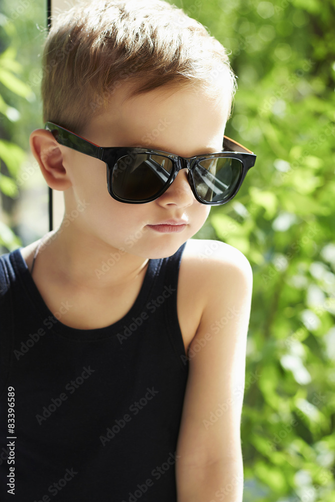 young handsome boy in sunglasses.Outdoor fashion child young handsome boy in sunglasses.Outdoor fashion child