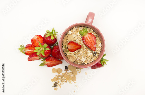 Bowl of muesli, strawberries and blueberries for healthy breakfa photo