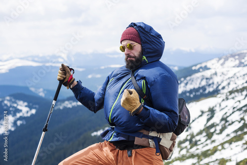 hiker male cheering in mountains in funny pose