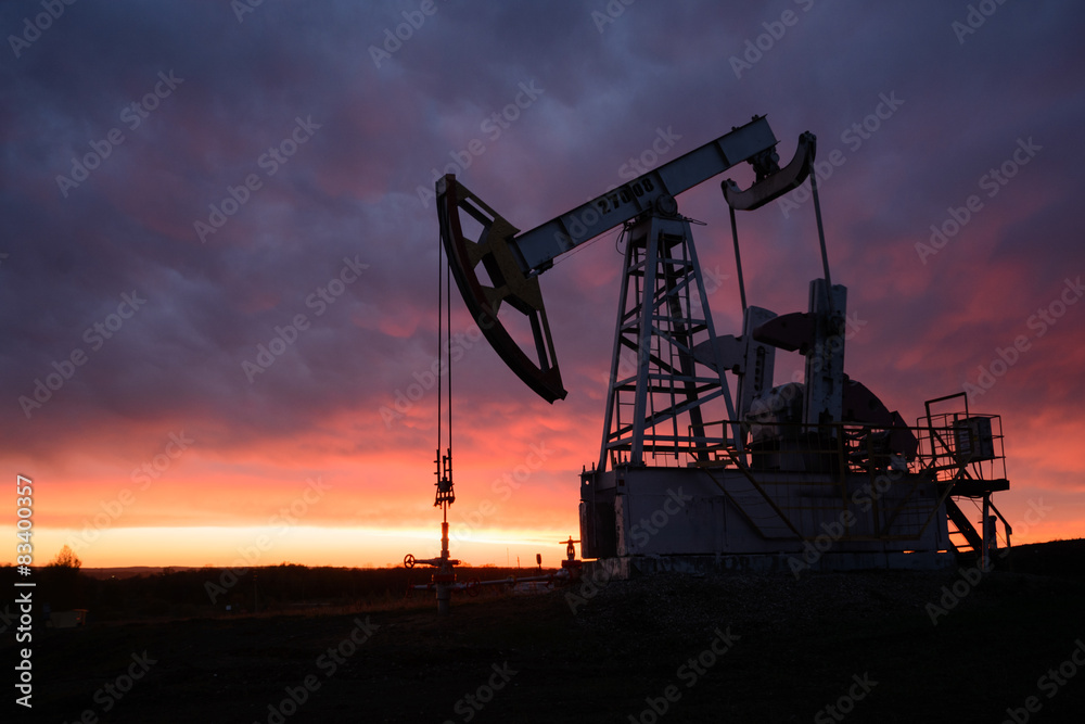 Oil pumping station at sunset