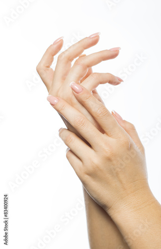 Woman rubs hand cream  makes a hand massage