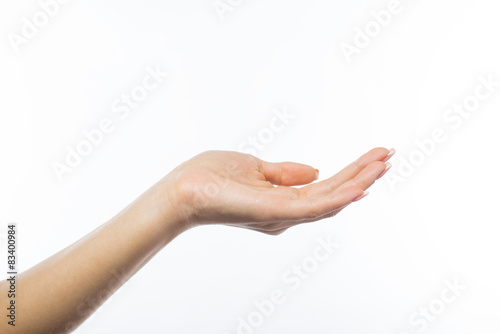 female hand holding something, isolated on white.