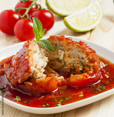 Bell peppers stuffed with meat, rice  and sauce on plate, select