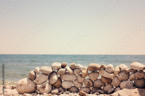 Artistic rock wall on a sandy beach