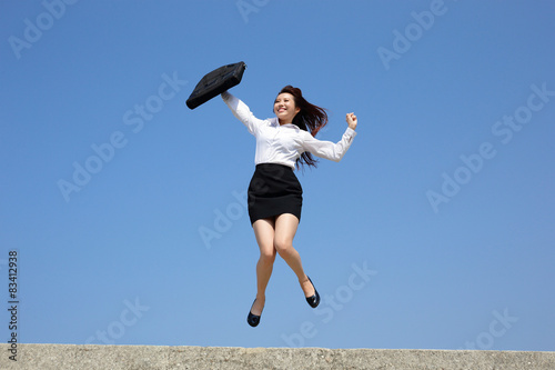 Successful business woman jump © ryanking999
