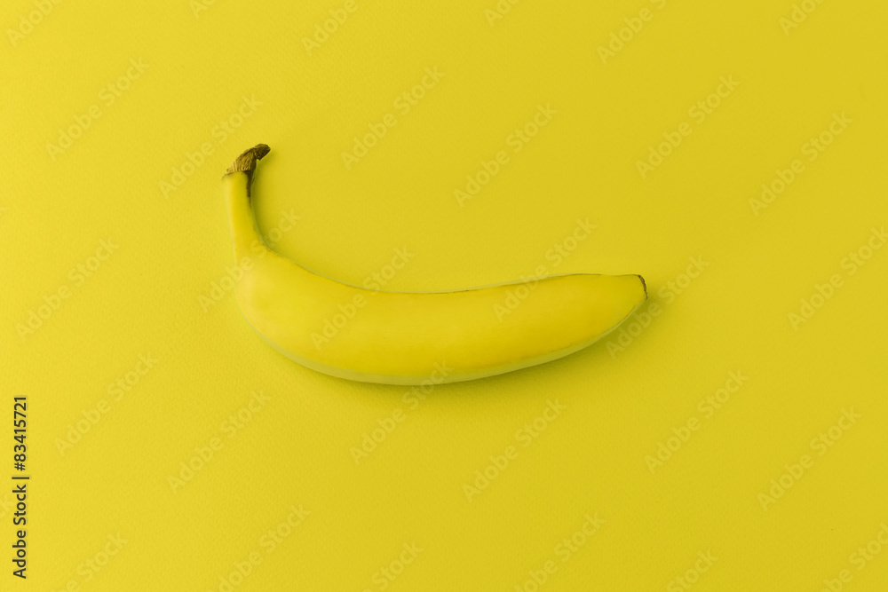 Banana on yellow background. Modern food background Banana on yellow background. Modern food background