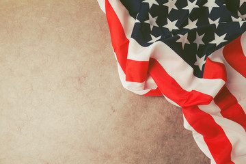 USA flag over vintage paper with copy space. 4th of July