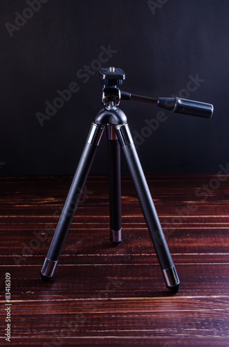mini tripod on wooden table background