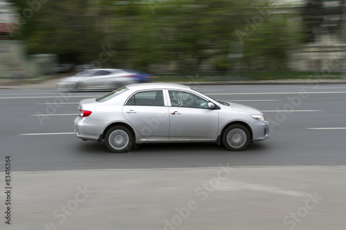 car in motion with blurred background.