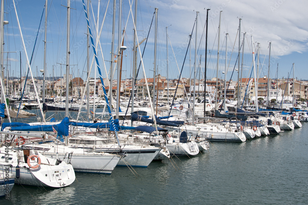 Sailing boats in Cambrils Harbour, Tarragona, Spain.