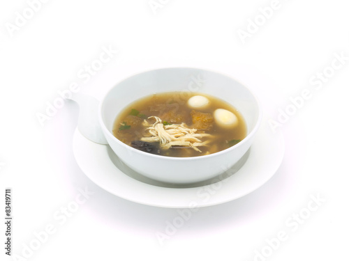 Fish maw soup in white bowl on white background