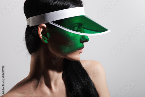 Bild auf Leinwand studio shoot of a woman wearing plastic visor cap