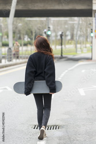 Hipster girl walks on road in the street, adolescence lifestyle. © leonardo2011