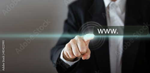 Businessman's hand pressing the icon with text "www..." 