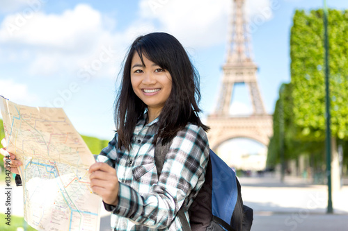Young attractive asian tourist visiting Paris
