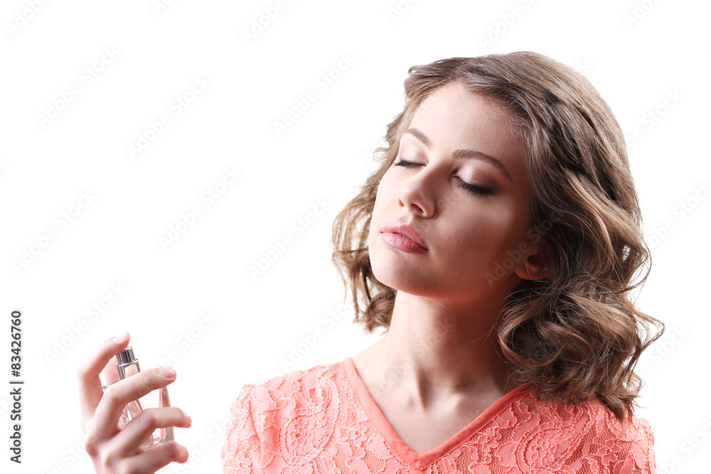 Beautiful woman with perfume bottle isolated on white Beautiful woman with perfume bottle isolated on white