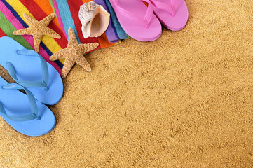 Summer beach sand background border with couple sunbathing towel star fish and accessories photo space for copy text