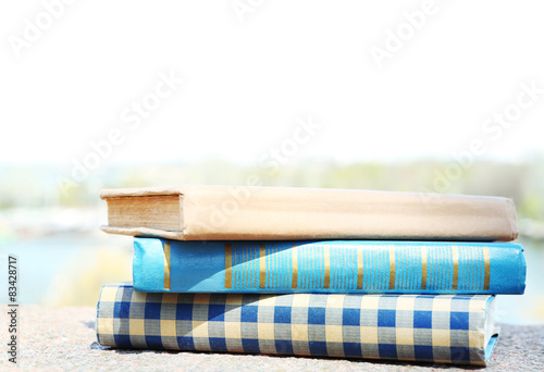 Stacked books on bright background