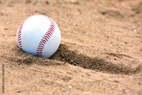 Baseball ball on sand