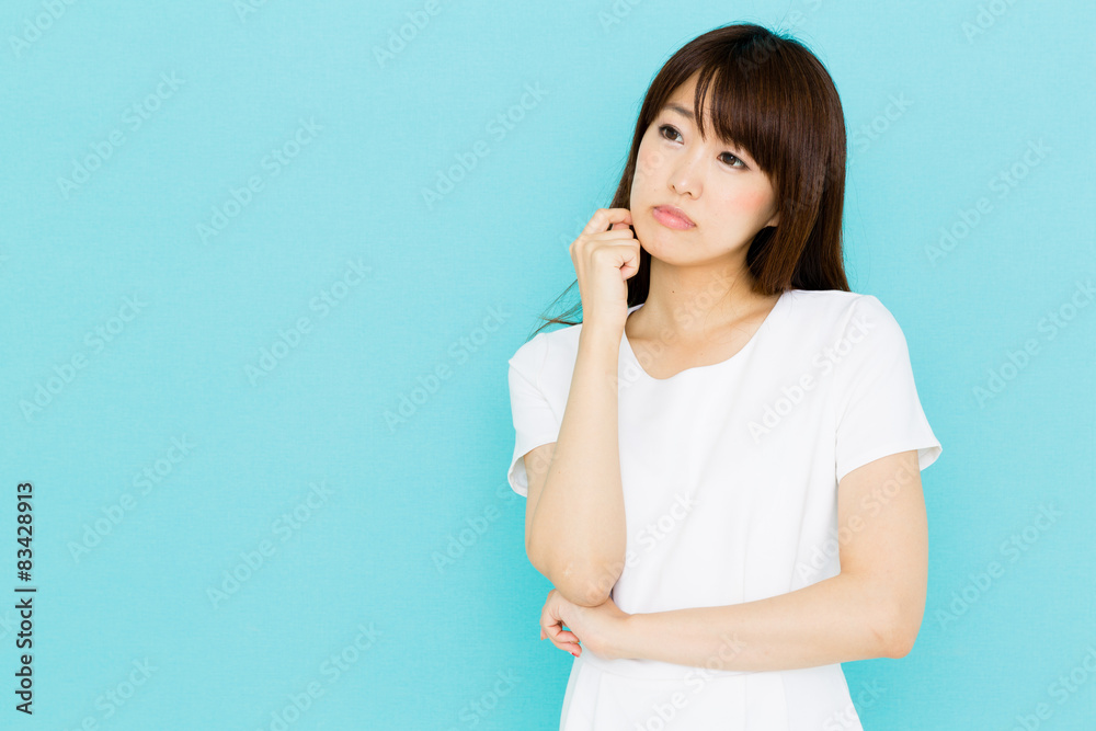 attractive asian nurse on blue background attractive asian nurse on blue background