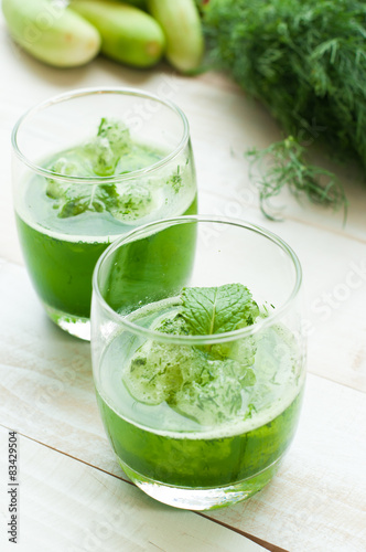 green smoothies on a brown background