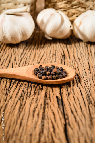 pepper dried and garlic on wood background