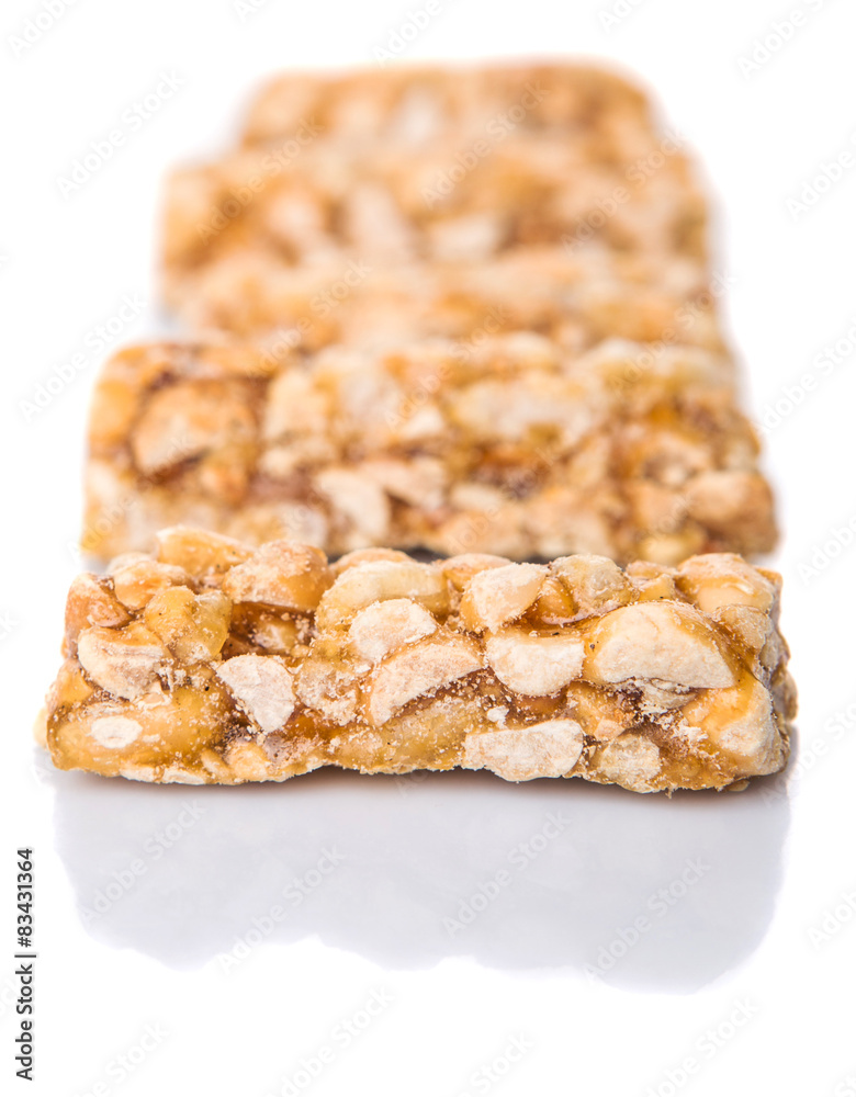 Caramelized candy nuts over white background Caramelized candy nuts over white background