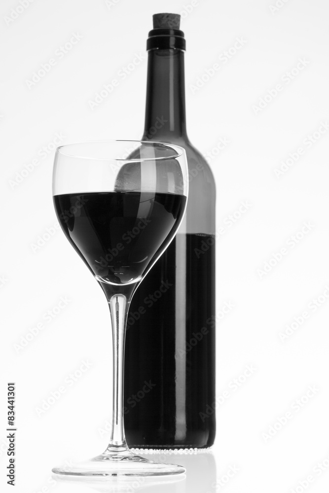 Wine glass and bottle with red wine Wine glass and bottle with red wine