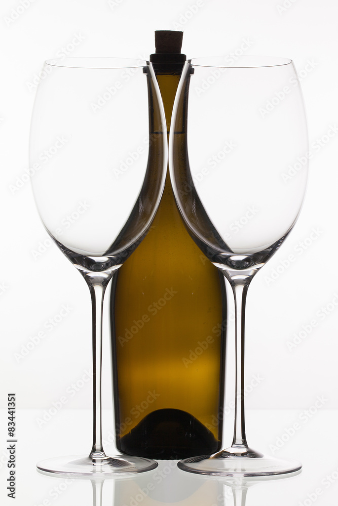 Two empty glasses of wine and brown bottle Two empty glasses of wine and brown bottle