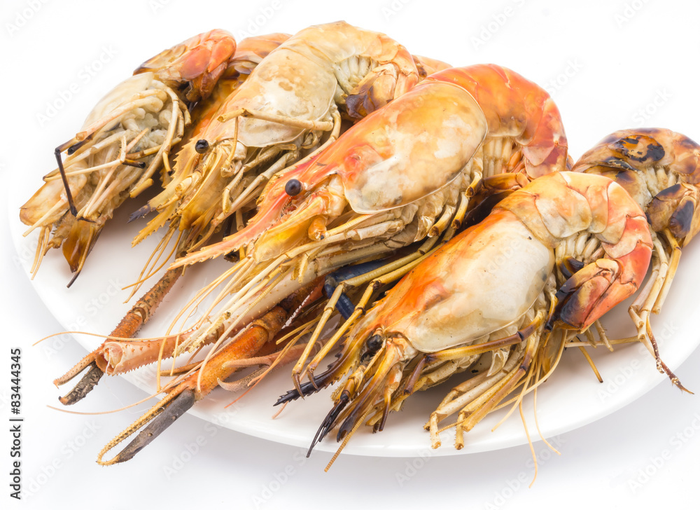 Grilled shrimps on the white plate in white background. Grilled shrimps on the white plate in white background.