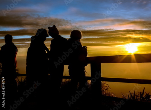 Silhouettes tourists are looking sunrise at view point photo