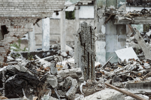 A closeup image of a ruined building with concrete and armature Fototapeta