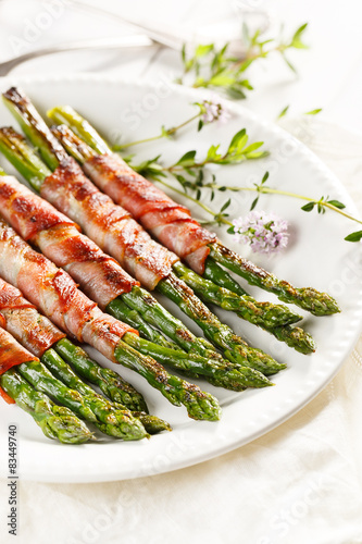Grilled green asparagus wrapped with bacon